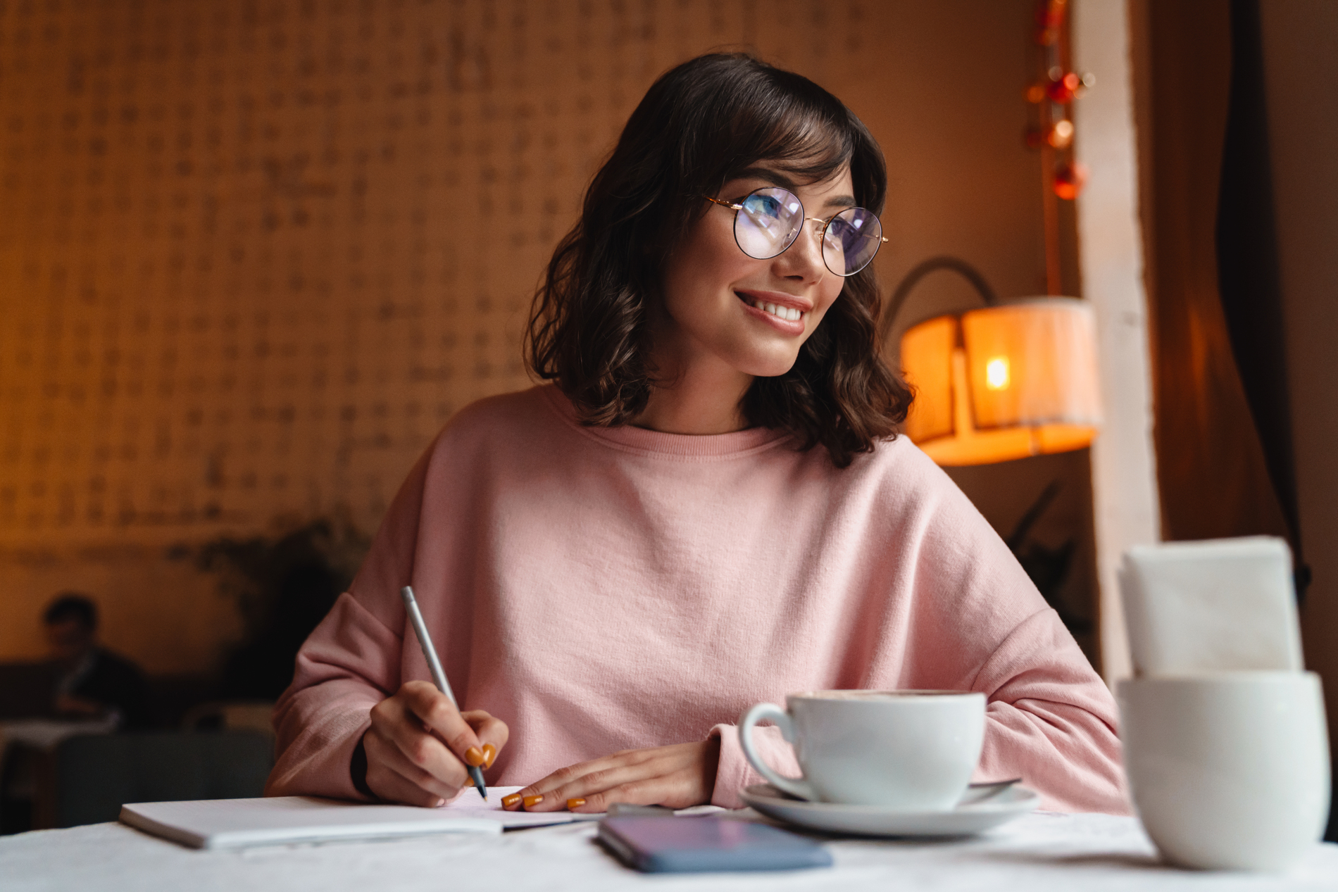woman smiling and working