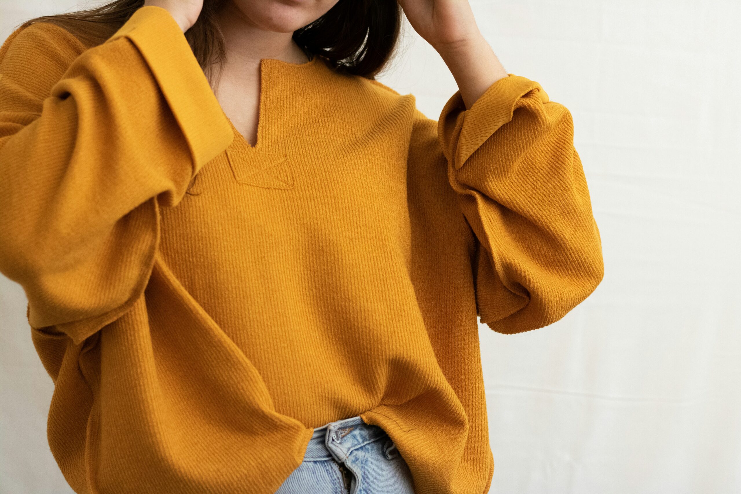 How to wear an oversized sweater without feeling swallowed